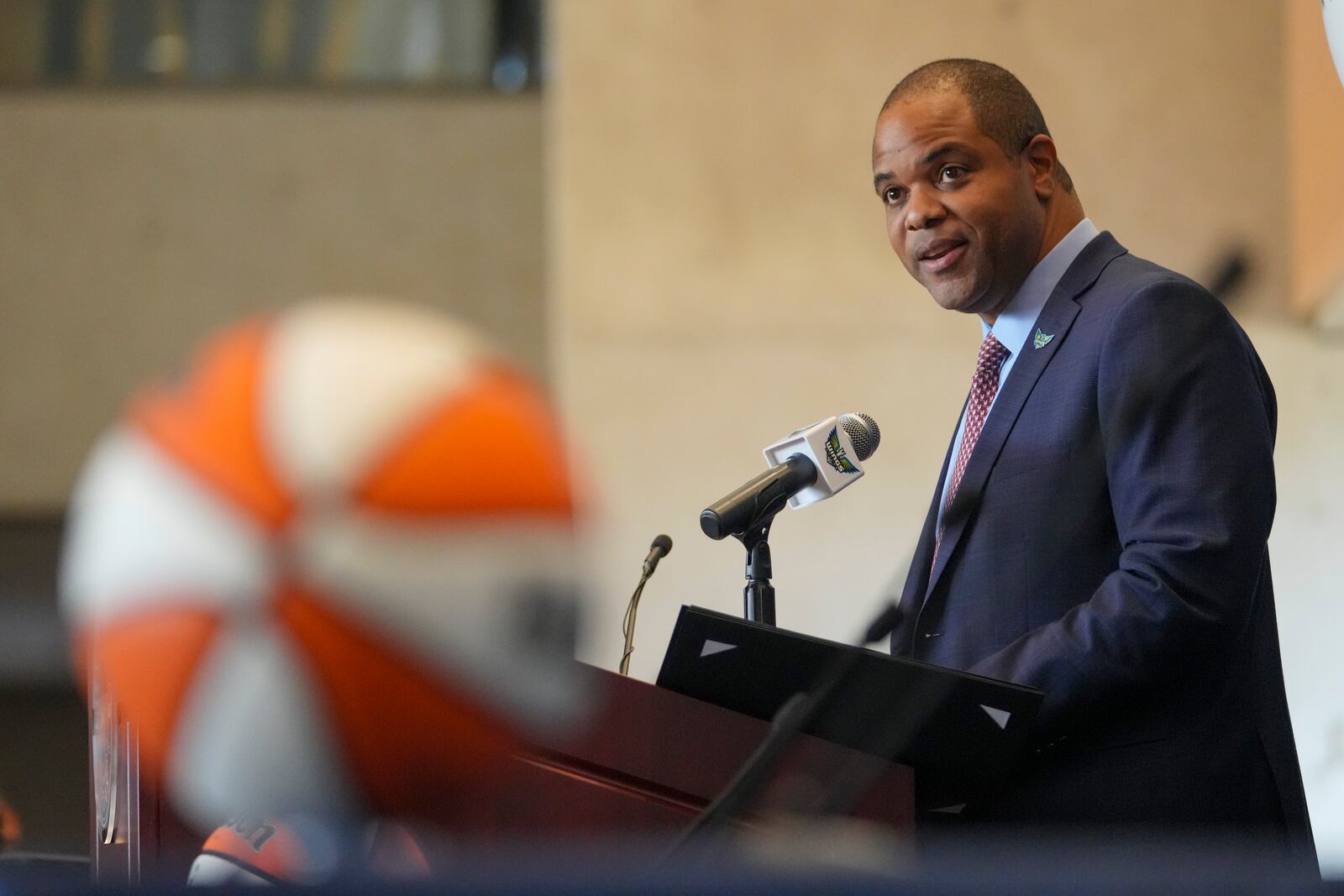 Dallas Mayor Eric Johnson speaks during an introductory press conference for the Dallas Wings' WNBA basketball draft selections Wednesday, April 23, 2025, in Dallas. (AP Photo/Julio Cortez)