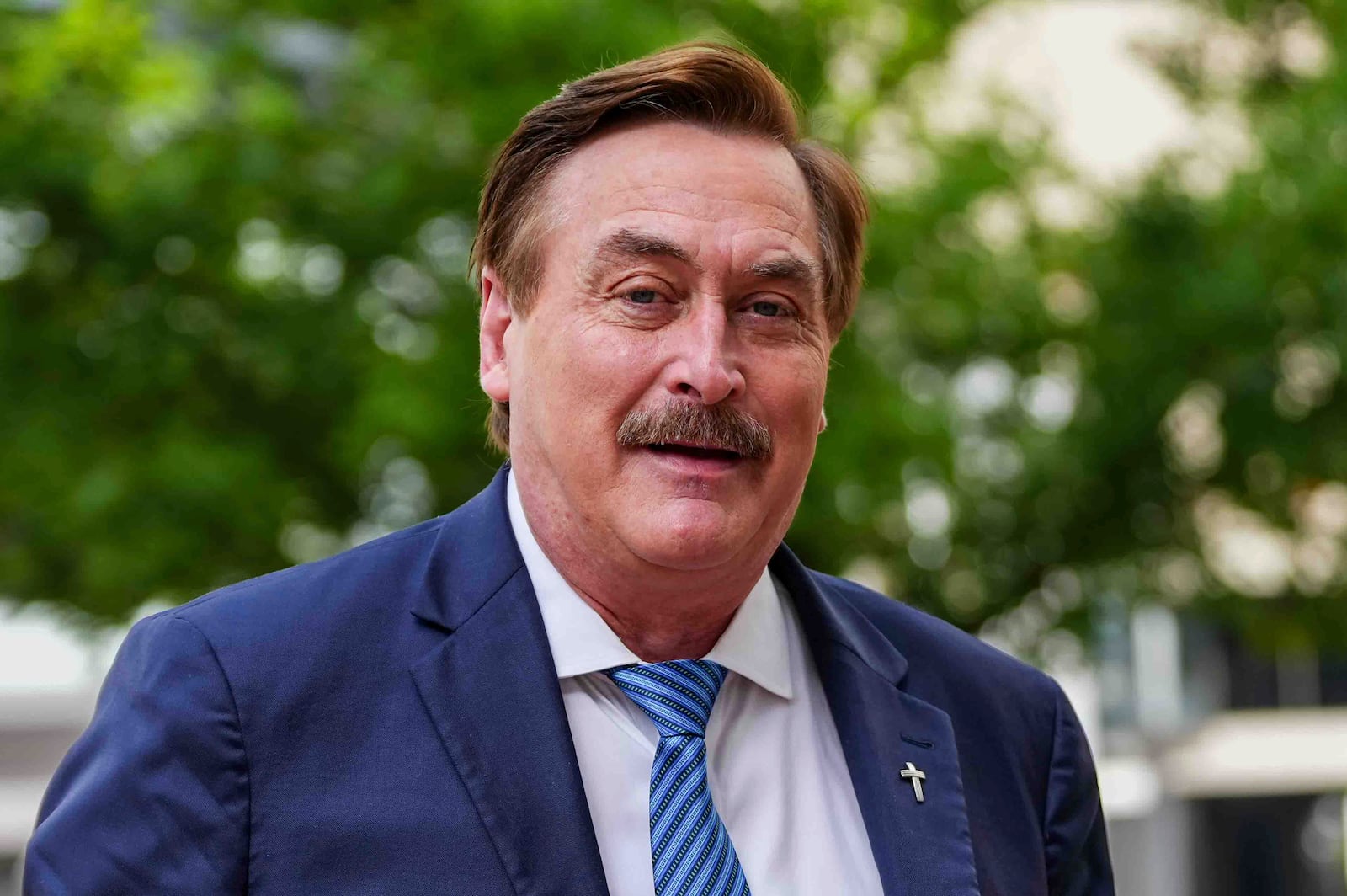 Mike Lindell walks into federal district court for a defamation trial on Thursday, June 5, 2025, in Denver. (AP Photo/Jack Dempsey)