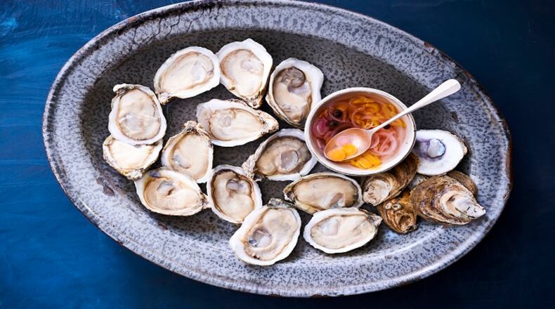 UNDATED â BC-EVERYDAY-FOOD-OYSTERS-ART-NYTSF â Plump, juicy raw oysters are topped with a drizzle of tangy vinegar sauce. (CREDIT: MIKKEL VANG)--ONLY FOR USE WITH ARTICLE SLUGGED â BC-EVERYDAY-FOOD-OYSTERS-ART-NYTSF â  OTHER USE PROHIBITED.