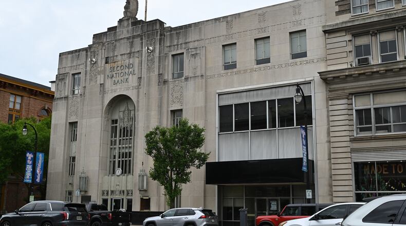 The city of Hamilton will consider at its May 22, 2024, meeting a request for tax abatement through the Community Reinvestment Area program CRDV Hamilton LLC, doing business as COhatch. They are planning to renovate the former US Bank building at 219 High St. in downtown for a co-working space and restaurant. The estimated project cost is $8.65 million. Pictured is the former US Bank building in downtown Hamilton on May 7, 2024. MICHAEL D. PITMAN/STAFF