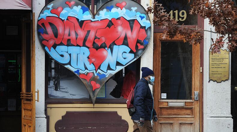 The FBI and Dayton police announced Monday, Nov. 29, 2021, they closed the 26-month investigation into the Aug. 4, 2019, Oregon District mass shooting. A Dayton Strong sign still stands in front of Ned Peppers Bar, near where the fatal shooting took place. MARSHALL GORBY\STAFF