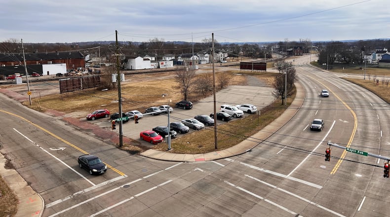 Hamilton staff is looking at creating an Amtrak station to serve the route between Cincinnati, Dayton, Springfield, Columbus and Cleveland, with a station near Maple Avenue and Martin Luther King Boulevard, where the city plans to move the historic train station. This view, from the county's downtown parking garage, shows MLK Boulevard to the right, and Maple Avenue to the right. NICK GRAHAM/STAFF