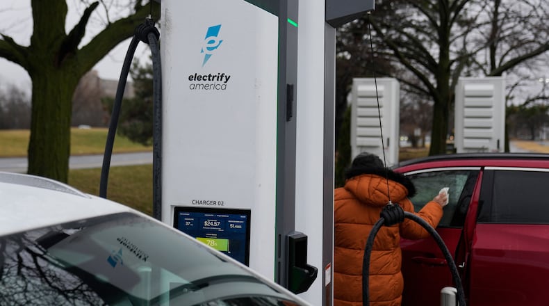Electric vehicles charge at a station Wednesday, March 11, 2026, in Lincolnwood, Ill. (AP Photo/Erin Hooley)