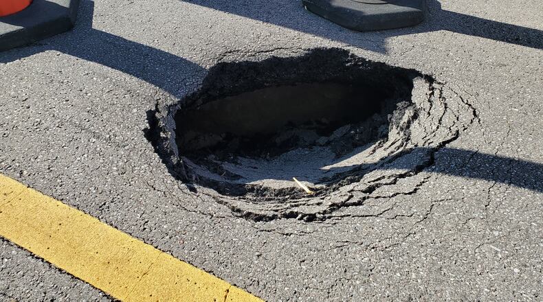 A large sink hole opened up Sunday night on West Chester Road and officials say the road will be closed for a week or more while they fix the problem. CONTRIBUTED