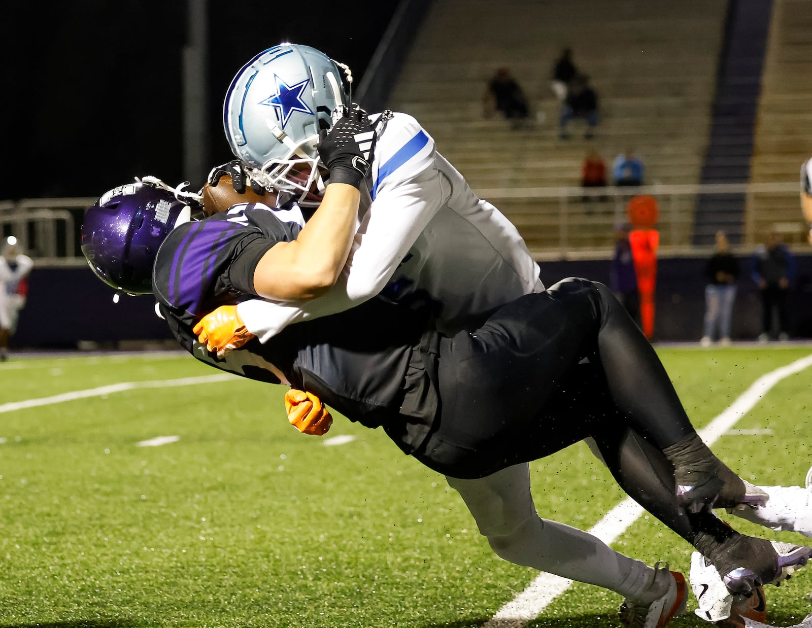 Hamilton's Tommy Southard tackles Middletown's Will Gibson during their football game Friday, Oct. 17 at Barnitz Stadium in Middletown. Big Blue won 14-10. NICK GRAHAM/STAFF