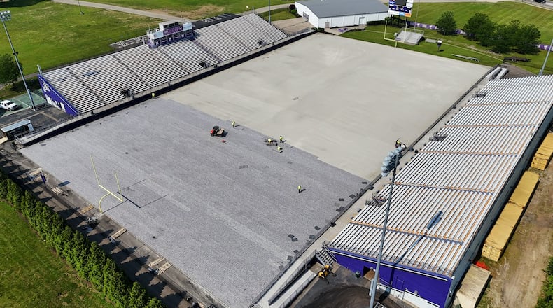 Middletown Schools’ Barnitz Stadium is currently replacing its aged synthetic playing turf and laying down a new field for its Middie football team. The stadium, which can hold 10,000 fans, is located across Minnesota Street from Middletown’s Rosa Parks Elementary in the southern part of the city and is now undergoing a $750,000 turf replacement. (Photo by Nick Graham/Journal-News)