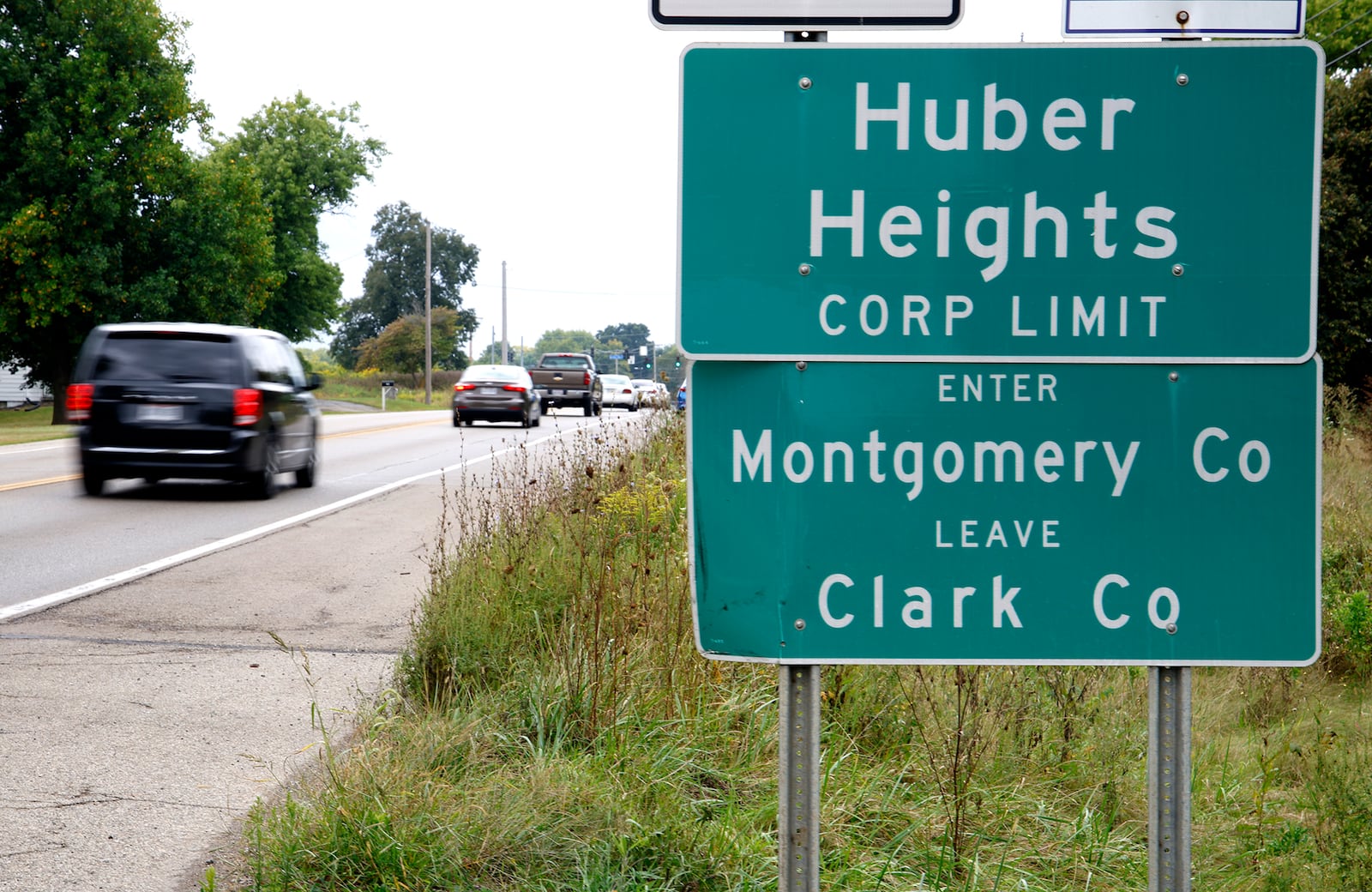 Cars pass a sign marking the Huber Heights corporation limit along Ohio 235 north of Interstate 70 near where the future Buc-ee's will be located. BILL LACKEY/STAFF