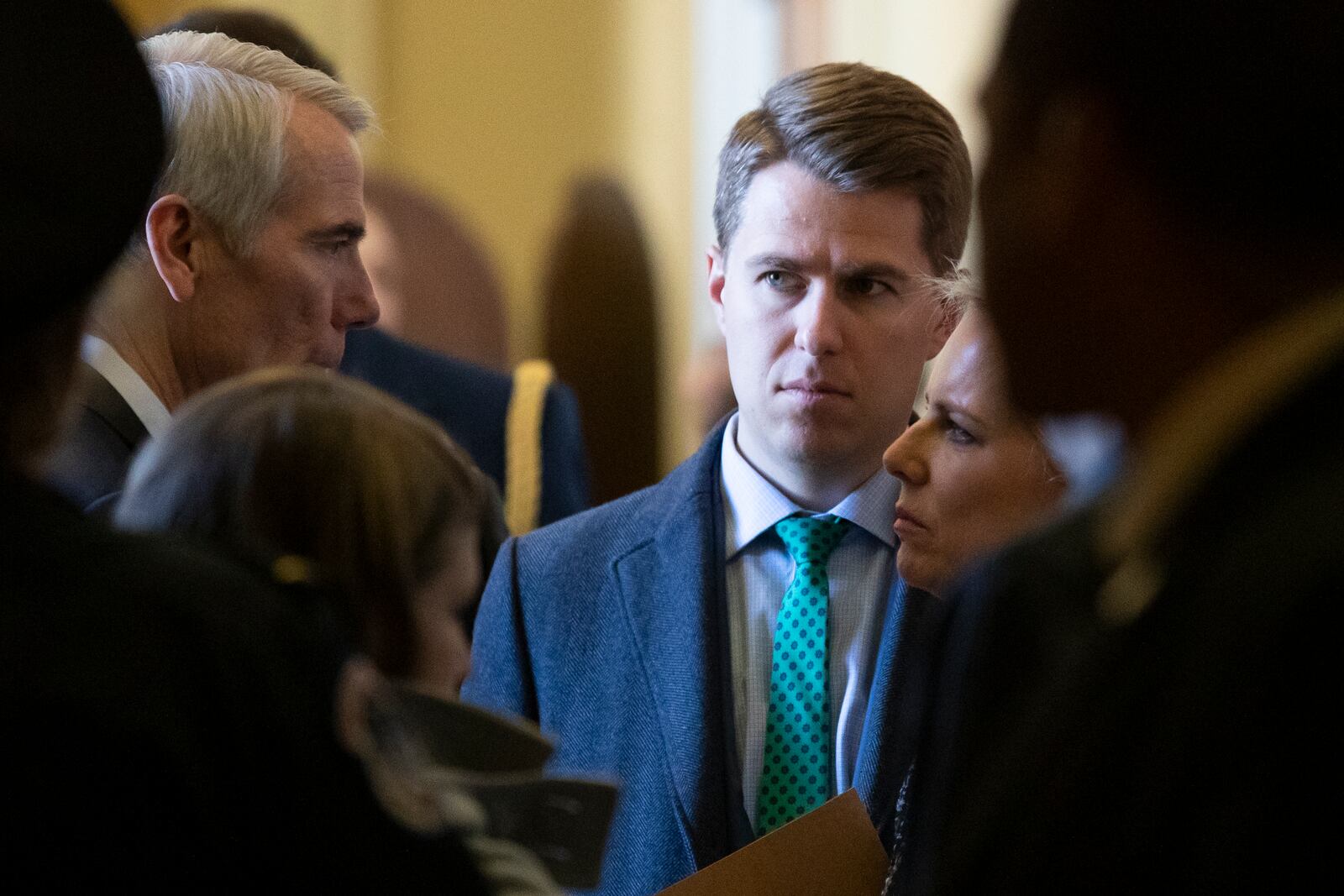 FILE -FILE - In this March 5, 2019, photo, Sen. Rob Portman, R-Ohio, left, talks with Homeland Security Secretary Kirstjen Nielsen, right, and her chief of staff Miles Taylor depart after the Republican Caucus luncheon on Capitol Hill in Washington. (AP Photo/Alex Brandon), File)