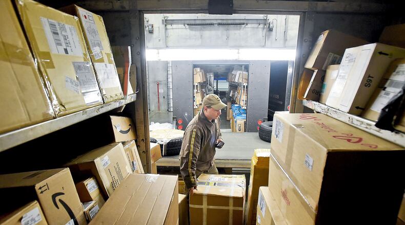 UPS driver Andrew Hancock checks the load before leaving on the day’s deliveries at the UPS depot in 2015 in Jackson, Pa. (Bob Donaldson/Pittsburgh Post-Gazette/TNS)