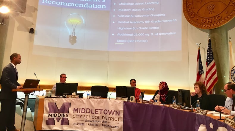Middletown Schools Superintendent Marlon Styles Jr. (left) saw his proposal to spend $10 million to expand Central Academy School - and change its academic program - unanimously rejected by the school board (right) during Monday evening’s meeting. The meeting, which was held in the city council chambers, drew one of the largest crowds in recent years, most being parents and supporters of Central Academy.(Photo Michael D. Clark/Journal-News)