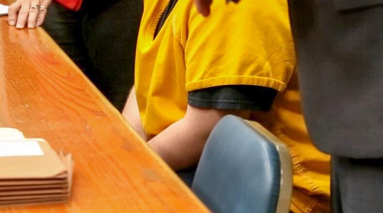 Statements made to police by a Hamilton 14-year-old charged with aggravated murder for allegedly shooting her father to death should be suppressed, her attorney is arguing. GREG LYNCH/STAFF