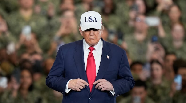 U.S. President Donald Trump arrives to meet with soldiers and servicemen at the USS George Washington at the U.S. Navy's Yokosuka base in Yokosuka, south of Tokyo, Tuesday, Oct. 28, 2025. (AP Photo/Eugene Hoshiko)