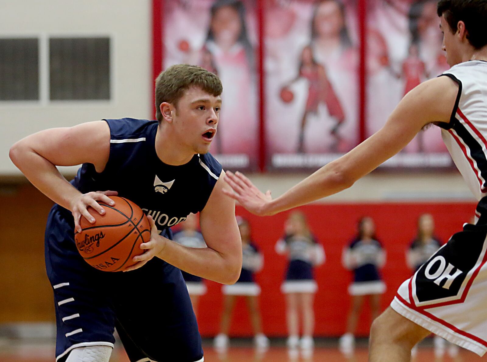 Edgewood guard Austin Scott is covered by Oak Hills forward Isaac Holmes on Tuesday night during a Division I sectional game at Fairfield Arena. CONTRIBUTED PHOTO BY E.L. HUBBARD