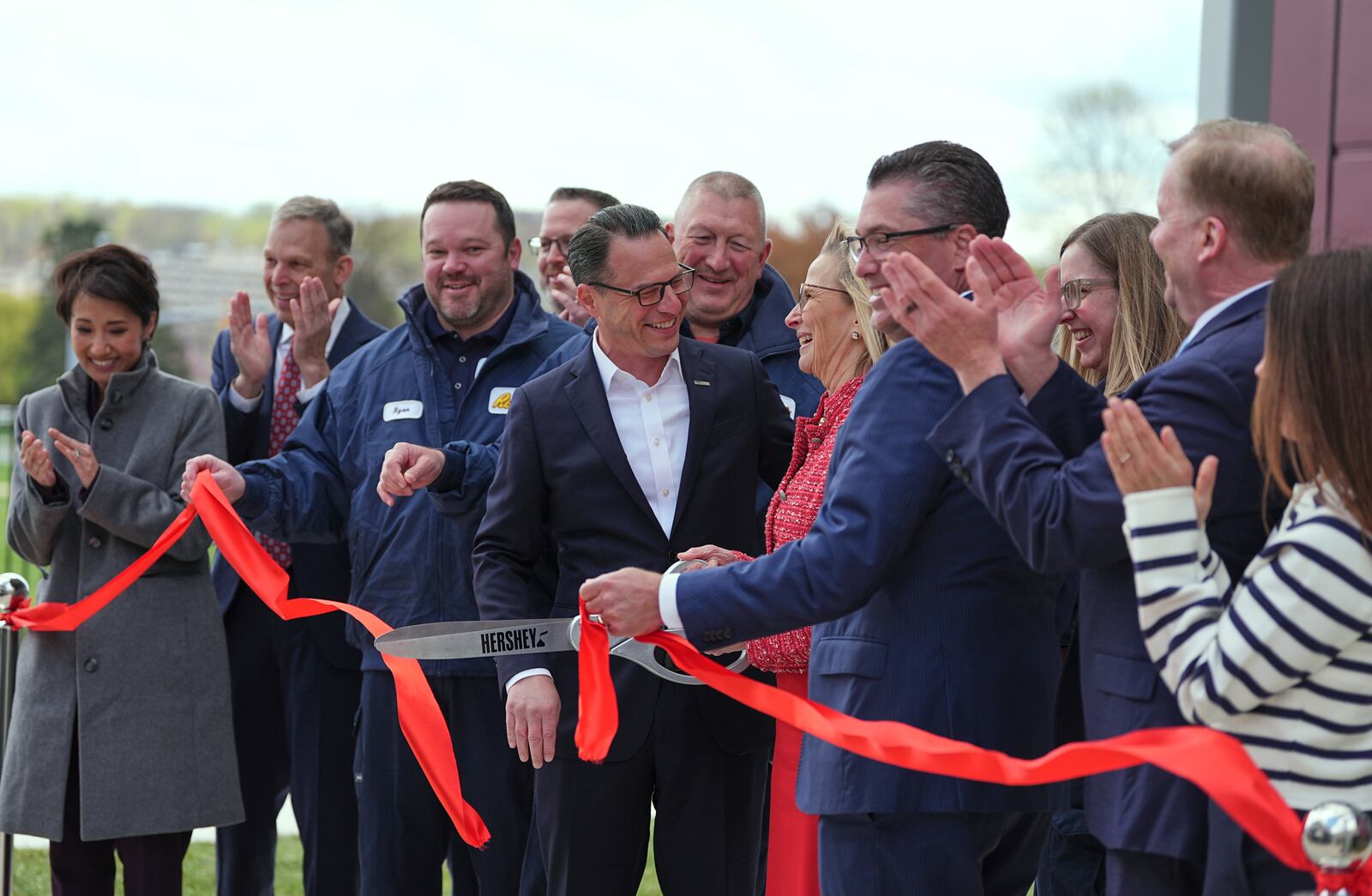 Pennsylvania Gov. Josh Shapiro takes part in a ribbon cutting ceremony the Hershey Company's new manufacturing plant in Hershey, Pa., Wednesday, April 16, 2025. (AP Photo/Matt Rourke)