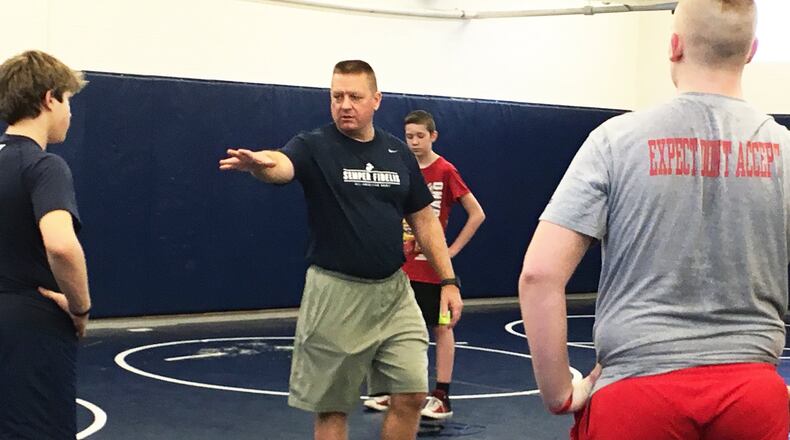 Talawanda High School football coach Larry Cox directs a recent workout at the school. RICK CASSANO/STAFF