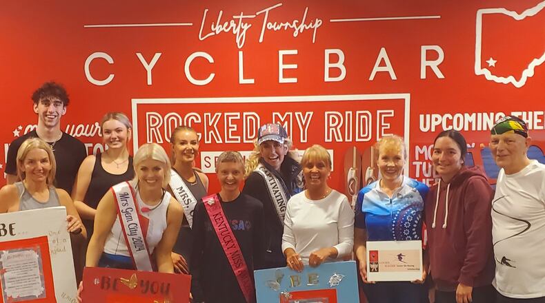 CycleBar hosted a cycling charity fundraiser with dozens of participants pedaling away on stationary bikes so youth snow skiers and special needs adults can afford to hit the slopes.  “Lucky Racer” founder and director Kris Scherer is pictured center back row. CONTRIBUTED