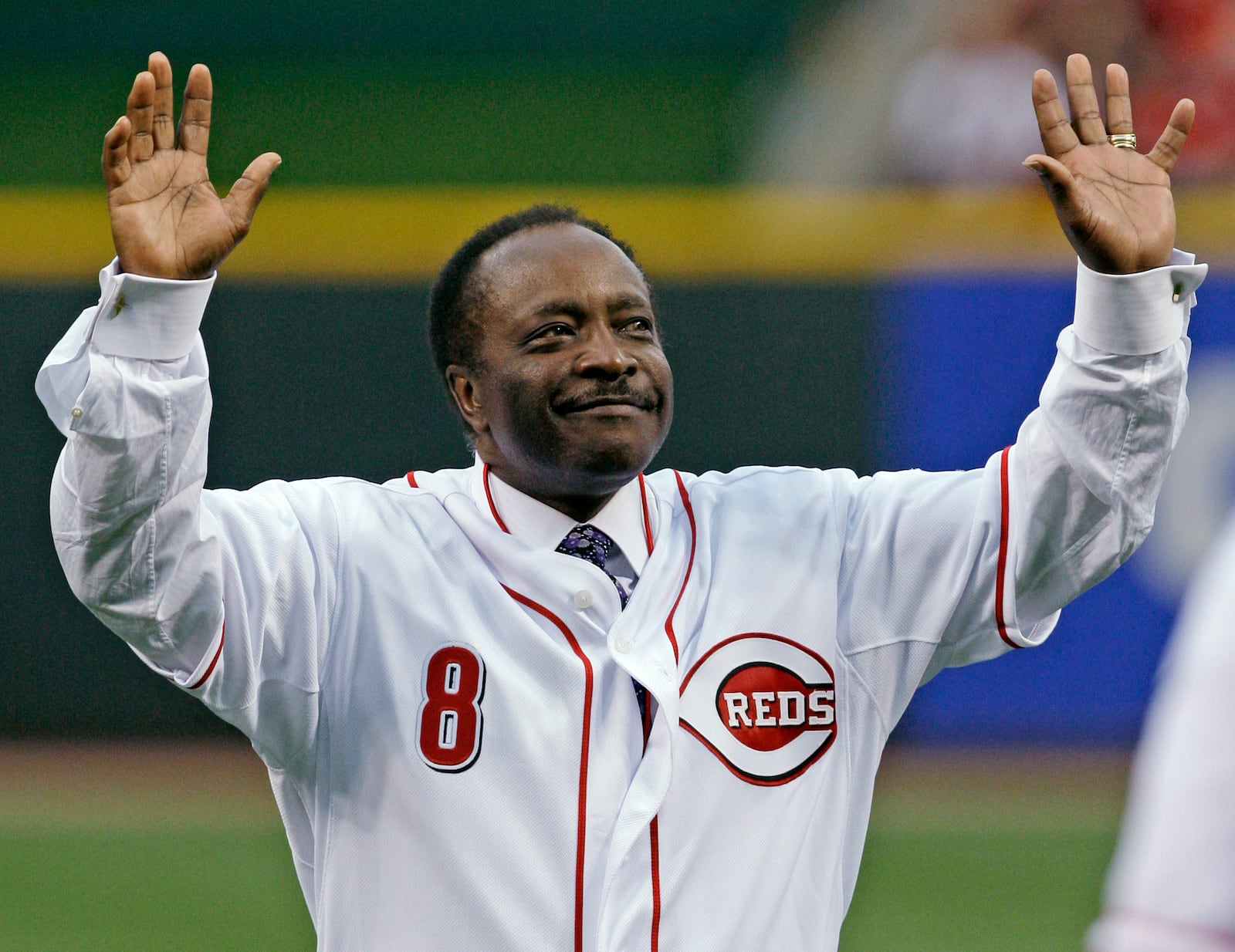 Cincinnati Reds Hall of Fame second baseman Joe Morgan acknowledges the crowd after throwing out a ceremonial first pitch prior to the Reds' baseball game against the St. Louis Cardinals in Cincinnati, in this Wednesday, April 7, 2010, file photo. AL BEHRMAN / ASSOCIATED PRESS