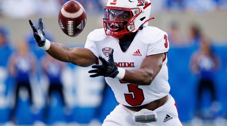 Miami (Ohio) running back Keyon Mozee reaches out and makes a catch during the first half of an NCAA college football game against Kentucky in Lexington, Ky., Saturday, Sept. 3, 2022. (AP Photo/Michael Clubb)