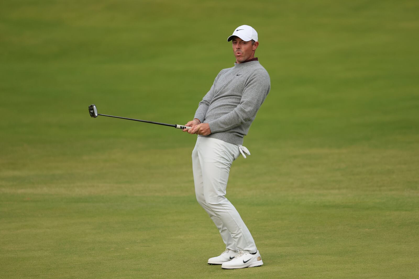Rory McIlroy of Northern Ireland reacts after putting on the 18th green during the first round of the British Open golf championship at the Royal Portrush Golf Club, Northern Ireland, Thursday, July 17, 2025. (AP Photo/Peter Morrison)