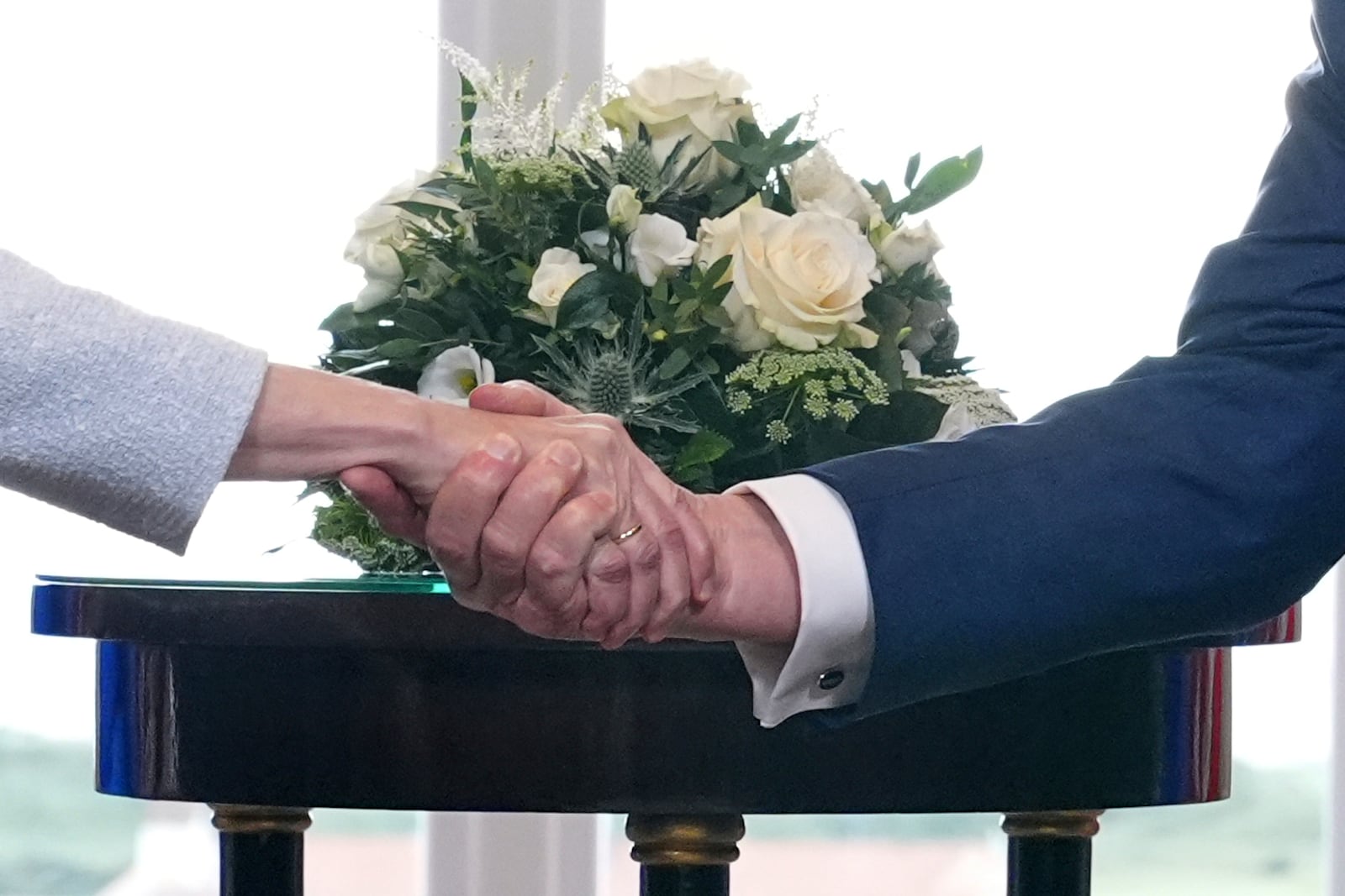 President Donald Trump and European Commission President Ursula von der Leyen shake hands after reaching a trade deal at the Trump Turnberry golf course in Turnberry, Scotland Sunday, July 27, 2025. (AP Photo/Jacquelyn Martin)