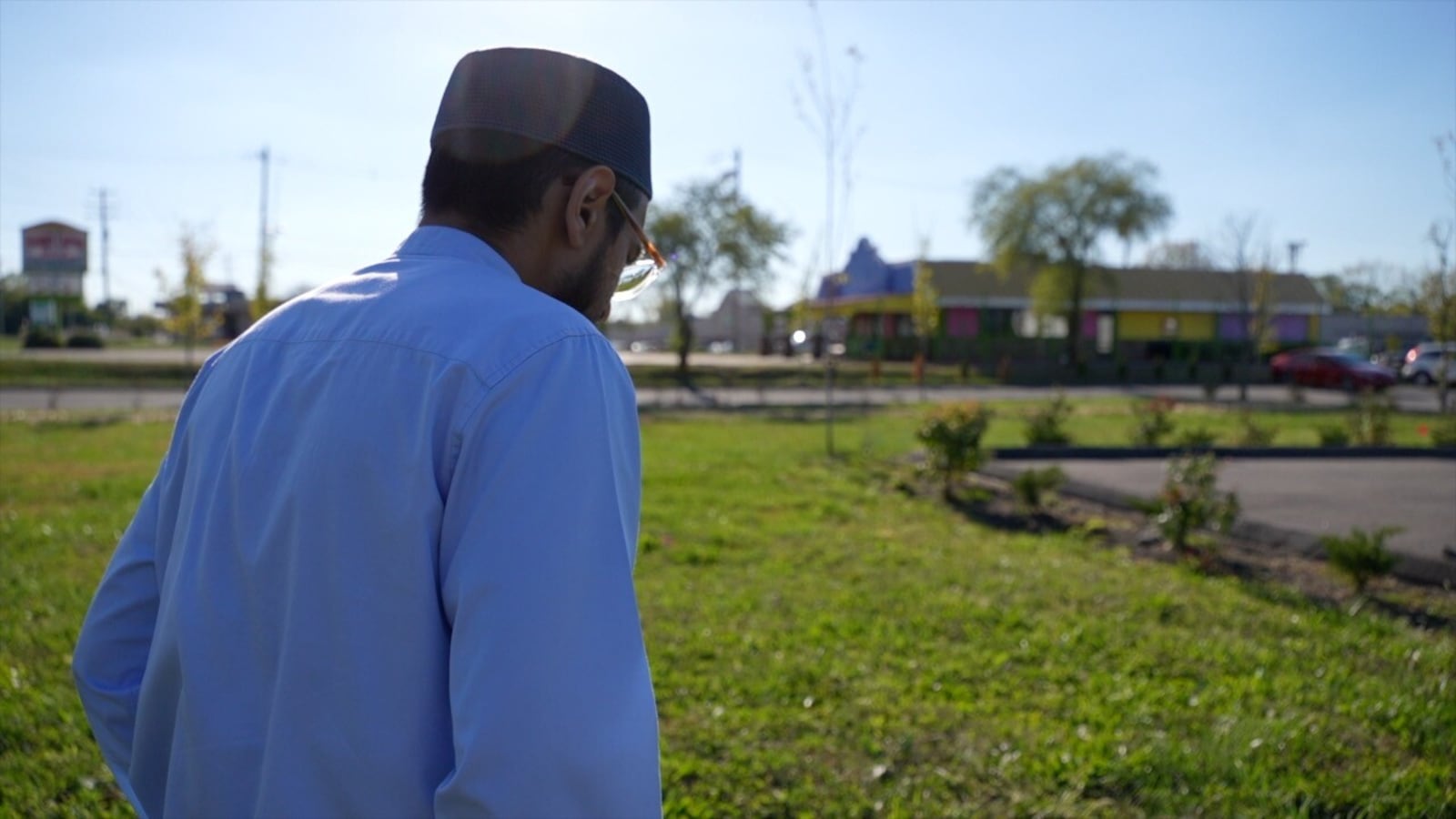Fawzan Hansbhai, imam at the ICM in Mason, shows WCPO 9 News plans for a new mosque. KEITH BIERYGOLICK/WCPO