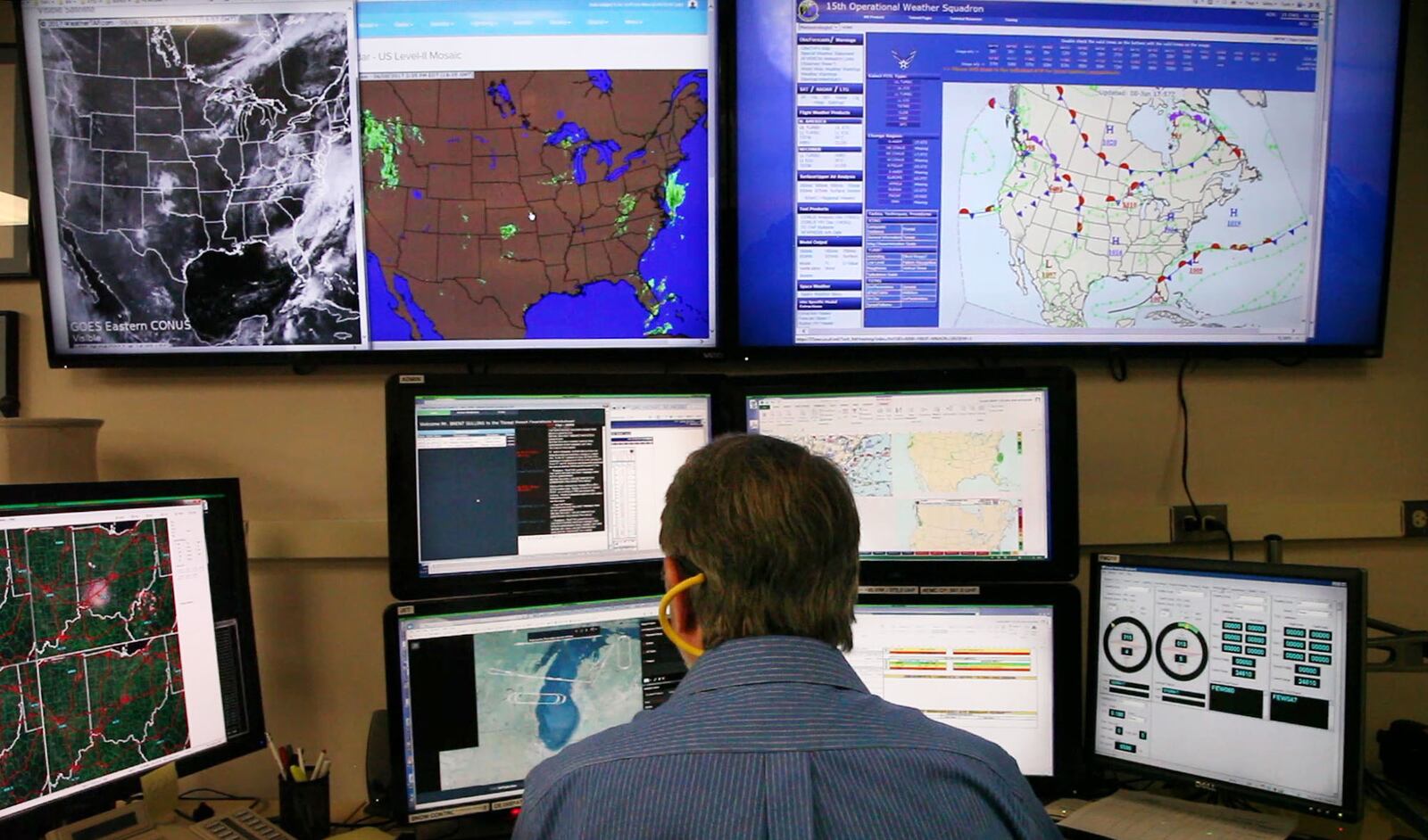 Brent Sullins, a meteorologist with the 88th Operations Support Squadron Base Weather Station at Wright-Patterson Air Force Base prepares a weather briefing for 445th Airlift Wing crew.  The Base Weather Station functions much like the National Weather Service but focuses on the needs of pilots and the base specifically.   TY GREENLEES / STAFF