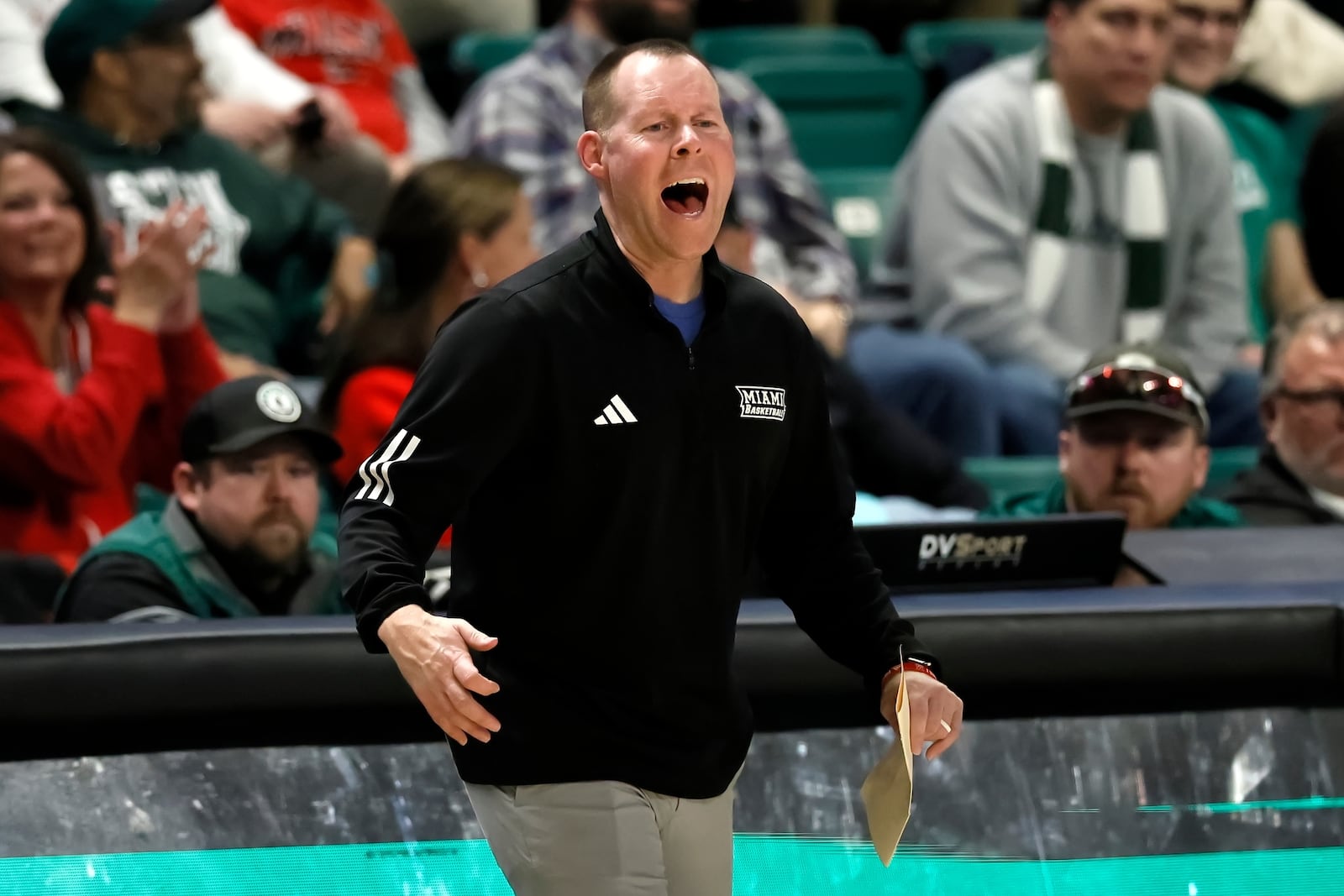 Miami (Ohio) head coach Travis Steele shouts to his team during the second half of an NCAA college basketball game against the Eastern Michigan Tuesday, Feb. 24, 2026, in Ypsilanti, Mich. (AP Photo/Duane Burleson)