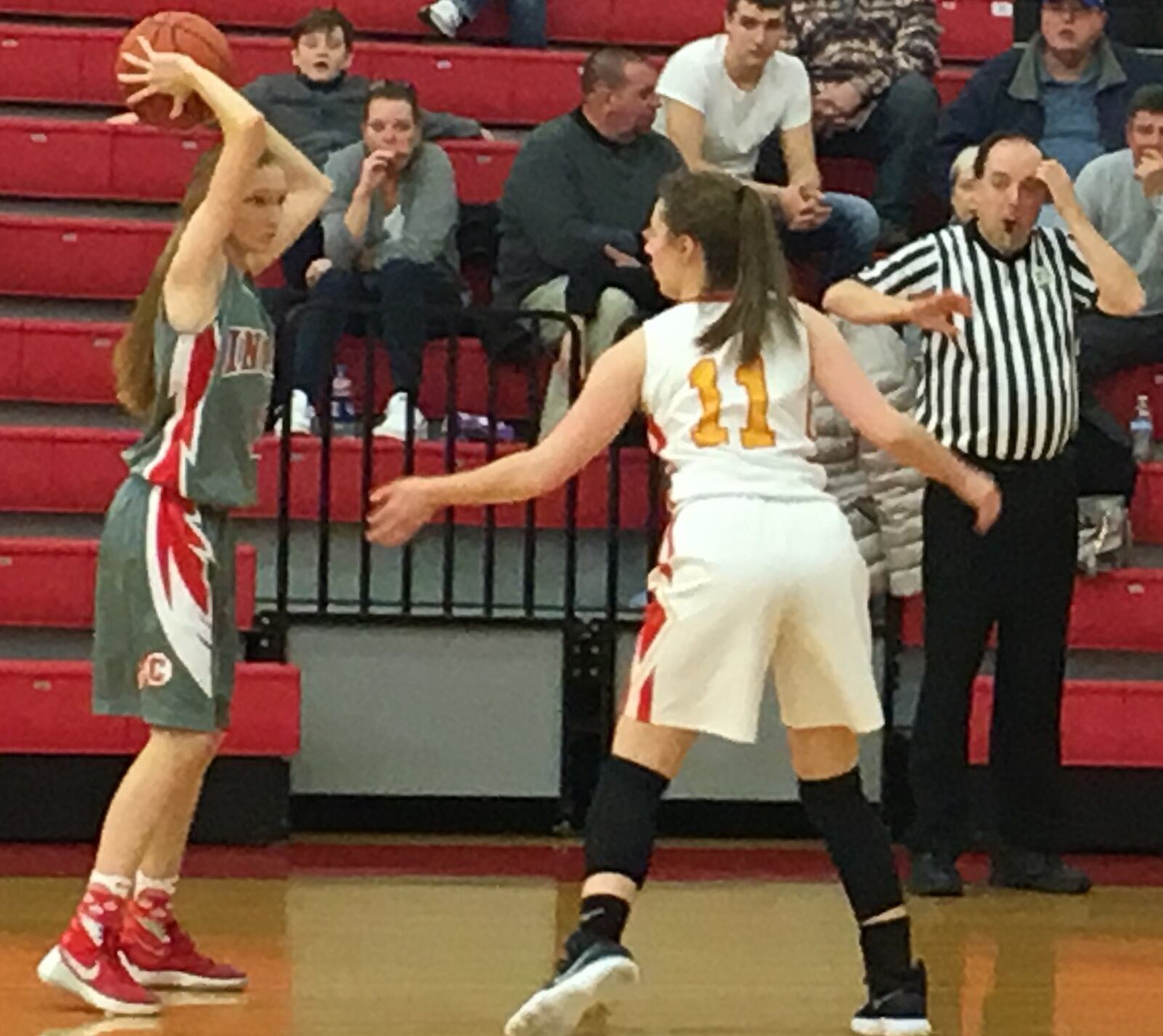 Fenwick’s Isabella Arends (11) guards Carlisle’s Caitlyn Stewart (2) during Wednesday night’s game at Fenwick. RICK CASSANO/STAFF