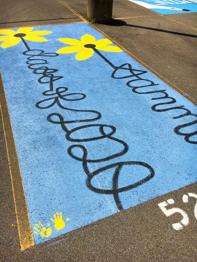 PHOTOS Lakota East seniors paint parking spots