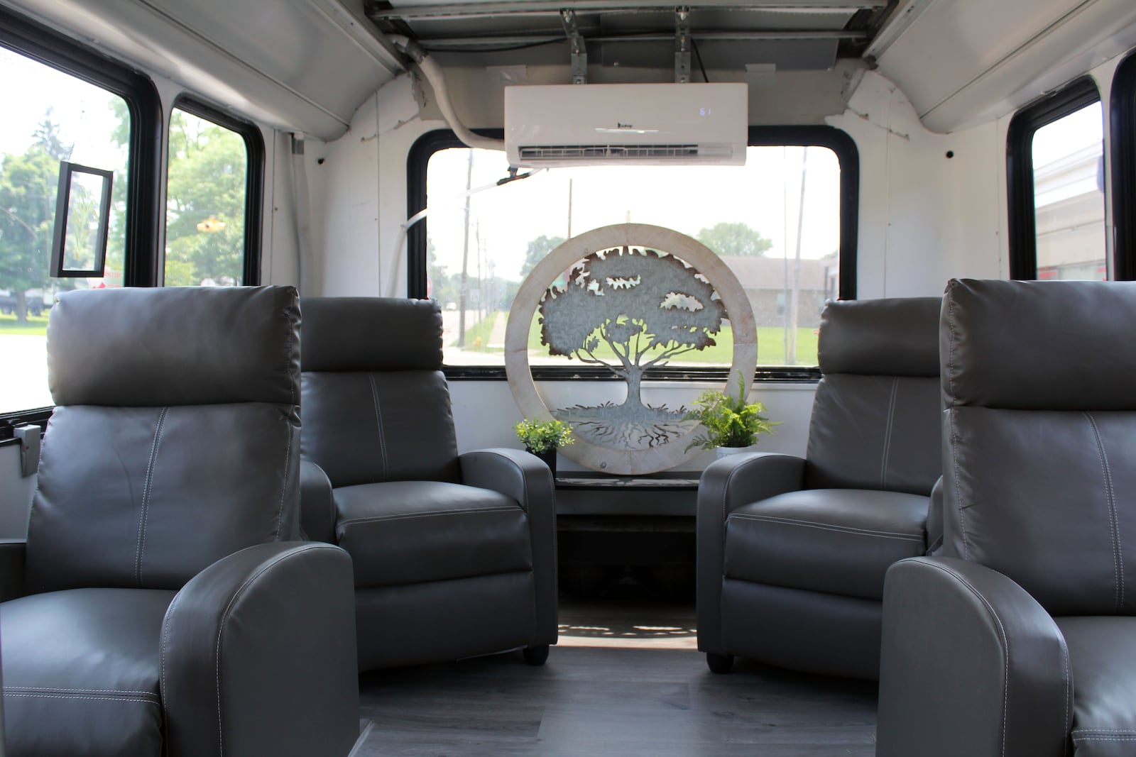 Brad Howard converted a Detroit airport shuttle bus into a mobile IV hydration clinic. Credit: Sue Kiesewetter