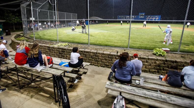 The lights were on as baseball action started up again just after midnight Tuesday morning, May 26, 2020, at West Side Little League fields in Hamilton. The stands are antiquated and are a safety concern, according to West Side Little League. The organization, which started in 1953, is embarking on a $1 million capital campaign to make facility upgrades, including new spectator stands that are safer, said WSLL Board President Josh Davidson. NICK GRAHAM/FILE