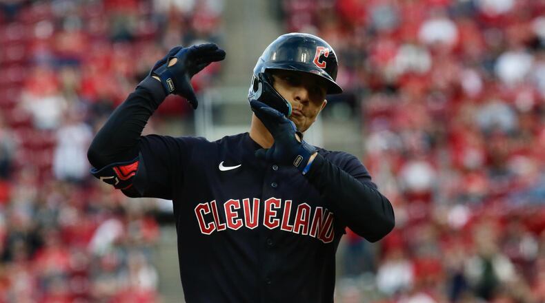 Andres Gimenez, of the Guadians, reacts after hitting a tie-breaking two-run home run against the Reds in the ninth inning on Opening Day on Tuesday, April 12, 2022, at Great American Ball Park in Cincinnati. David Jablonski/Staff