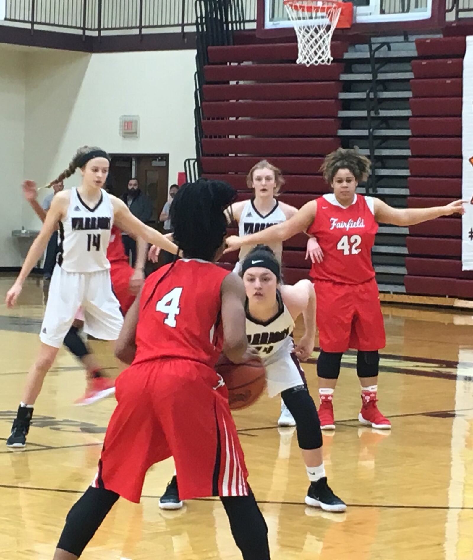 Lebanon’s Ashley Popp (24) defends Fairfield’s Zahrya Bailey (4) during Monday night’s game at Lebanon. RICK CASSANO/STAFF