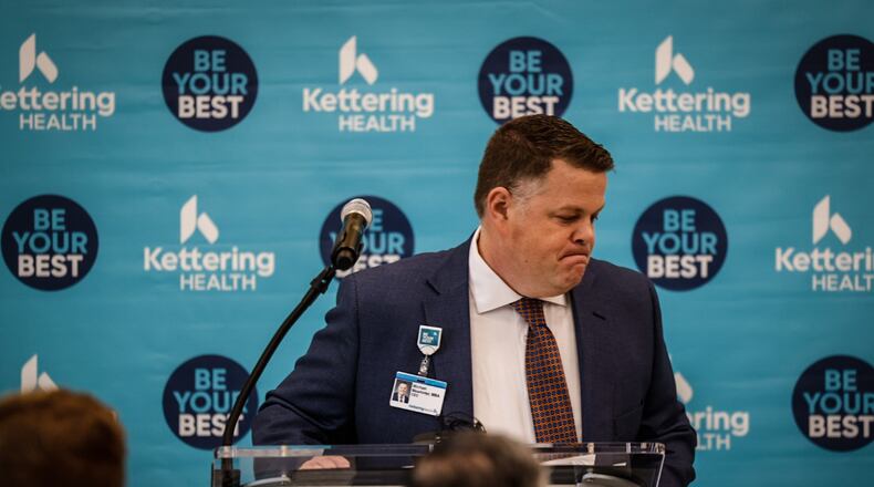 File - Michael Mewhirter, who was Kettering Health interim CEO at the time, finishes his remarks before a ribbon cutting ceremony at the new Kettering Health Centerville Health Center on Friday, Jan. 27, 2023. Mewhirter later transitioned into the role of chief administrative officer and will now be leaving the network in April. JIM NOELKER/STAFF