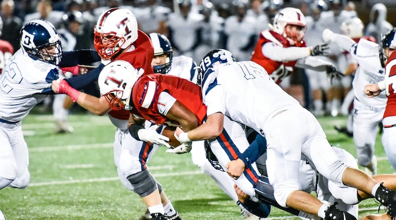 Edgewood’s Clayton Gerber tackles Talawanda running back Terell Wills during their game Oct. 12 in Oxford. Visiting Edgewood won 54-0. NICK GRAHAM/STAFF