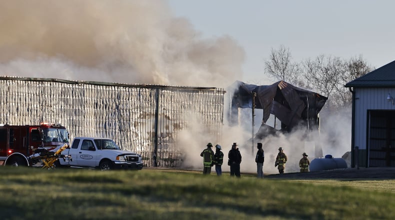The Madison Twp. Fire Department and mutual aid departments are battling a fire this morning at Norvell's Turf Management Inc. on Elk Creek Road. NICK GRAHAM/STAFF