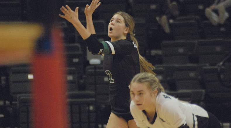 Badin's Alyvia Hegemann hits a serve as teammate Ellie Green looks on during Friday's Diviision II state semifinal match at the Nutter Center. Chris Vogt/CONTRIBUTED