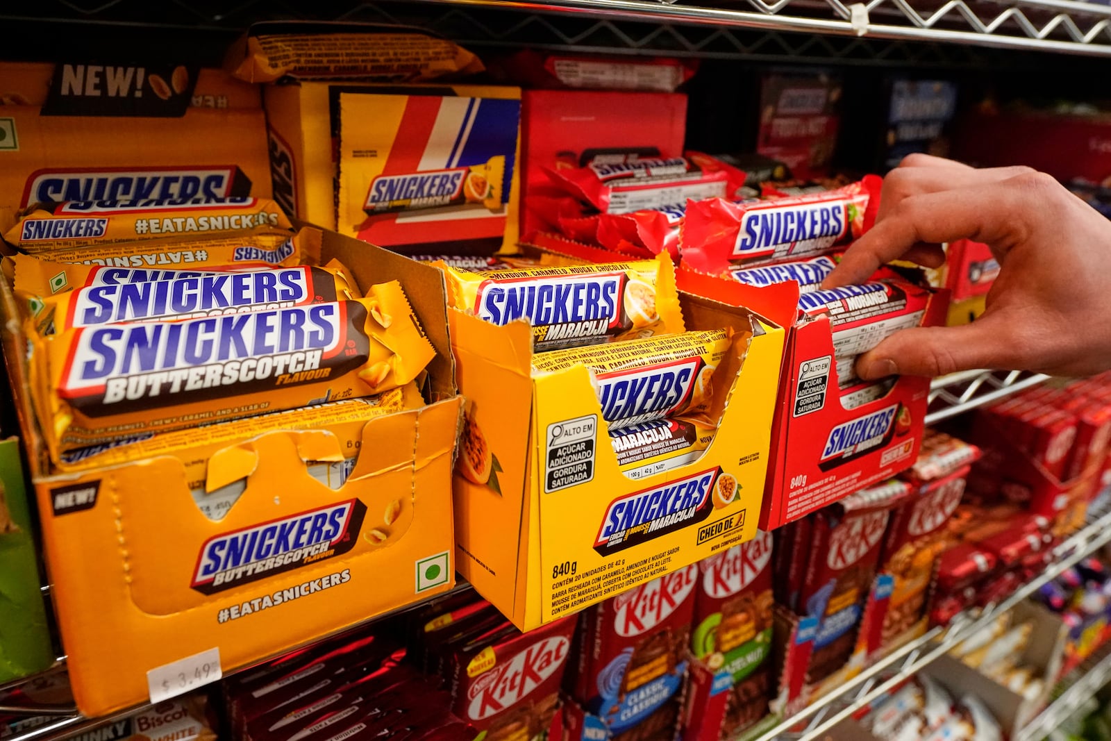 Snickers bars from Brazil are displayed for sale at Economy Candy in New York's Lower East Side, Friday, April 4, 2025. (AP Photo/Richard Drew)