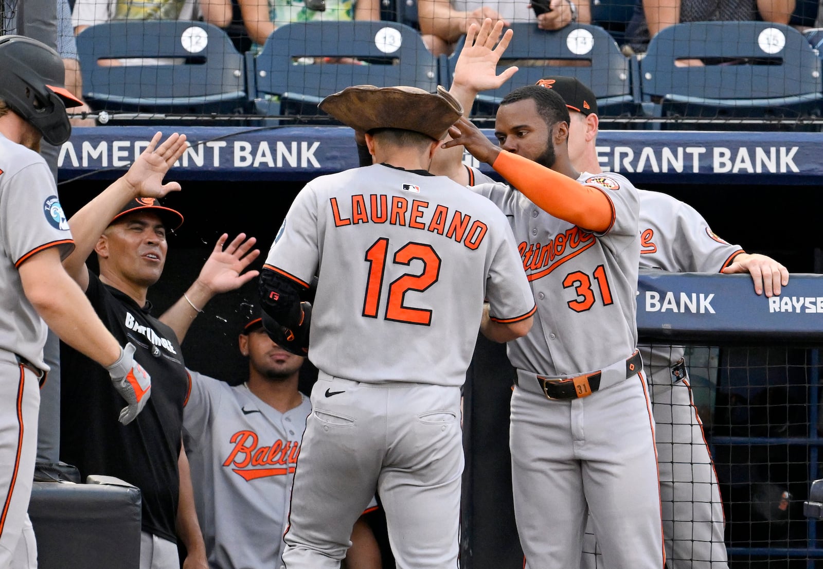 Baltimore Orioles' Ramón Laureano (12) and Cedric Mullins (31) celebrate Laureano's three-run home run during the second inning of a baseball game against the Tampa Bay Rays, Wednesday, June 18, 2025, in Tampa, Fla. (AP Photo/Jason Behnken)