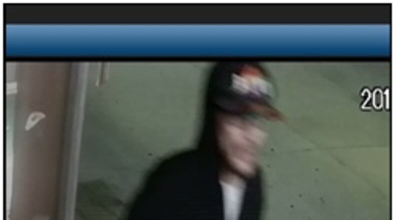 Hamilton detectives are looking for this man who allegedly pulled a gun while robbing Minnick’s Drive Thru last week. (Contributed Photo)