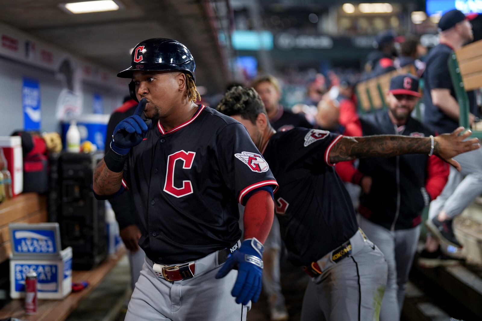 Cleveland Guardians Jose Ramirez, left, celebrates with teammates in the dugout after hitting a home run during the ninth inning of a baseball game against the Los Angeles Angels in Anaheim, Calif., Friday, April 4, 2025. (AP Photo/Eric Thayer)