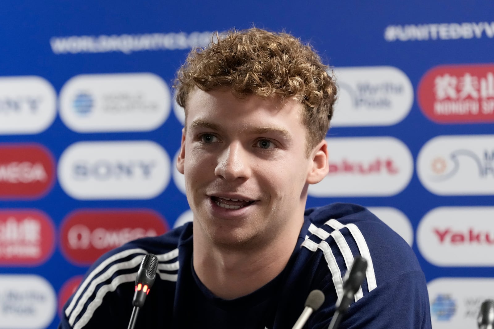 Leon Marchand from France speaks to the media during the press conference at the World Aquatics Championships in Singapore, Saturday, July 26, 2025. (AP Photo/Lee Jin-man)
