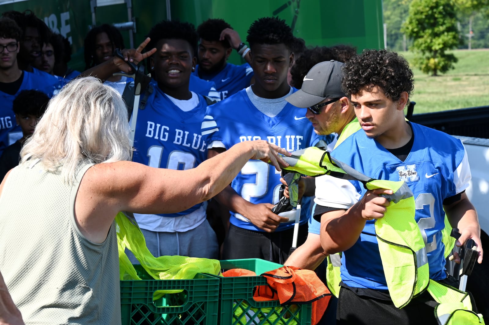 Hamilton and Badin play each other on Friday night, Aug. 22, 2025, in the season opener for Ohio high school football. However, the intercity athletic rivals teamed up on Saturday morning, Aug. 16, 2025, to help clean up part of their hometown, including the Booker T. Washington Center and Bailey Square. MICHAEL D. PITMAN/STAFF