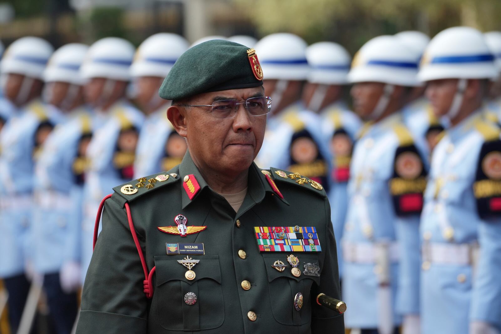 Malaysia's Chief of Defence Force Mohd Nizam Jaffar inspects honor guards during a welcoming ceremony prior to their meeting in Jakarta, Indonesia, Wednesday, April 16, 2025. (AP Photo/Achmad Ibrahim)