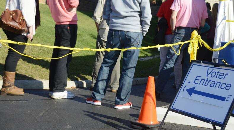 Warren County voters waited around 90 minutes during the middle of the early voting hours on Sunday at the board of elections office in Lebanon. Elections officials said voters were waiting in line about an hour before early voting began on Sunday. Pictured, voters at this point in the line were still about 40 minutes away from casting a ballot.
