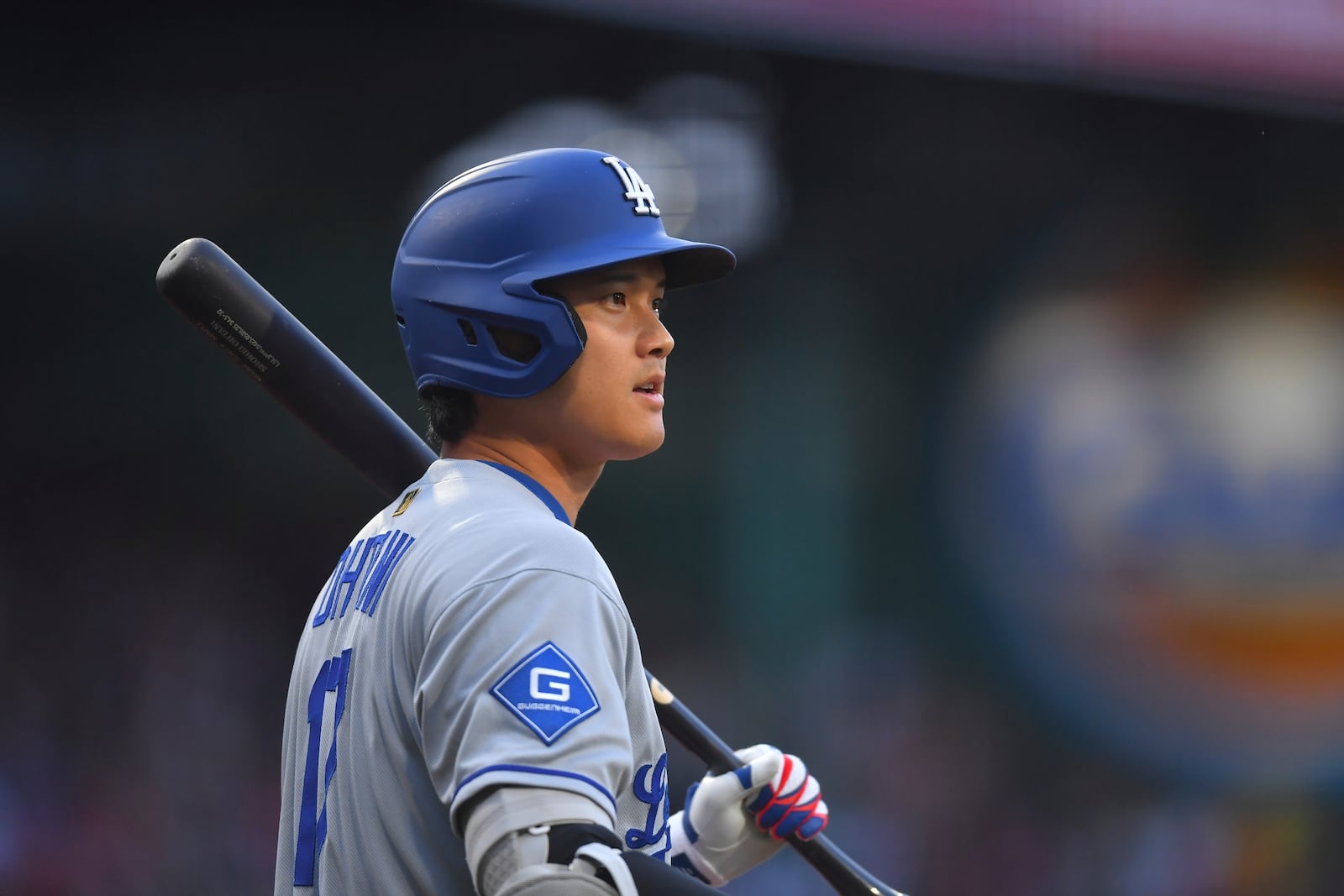 Los Angeles Dodgers' Shohei Ohtani looks on before taking an at-bat in the first inning of a baseball game against the Boston Red Sox, Saturday, July 26, 2025, in Boston. (AP Photo/Steven Senne)