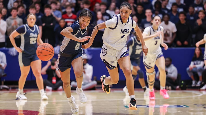 Fairmont senior guard Kaylah Thornton (left) and Pickerington Central's Zoe Coleman chase after a loose ball during a Division I state semifinal on Thursday, March 12 at University of Dayton Arena. Thornton had nine points and three steals at halftime. BRYANT BILLING / STAFF