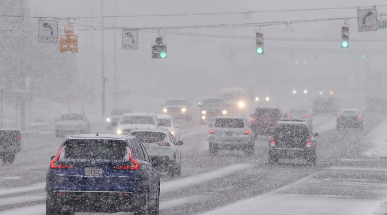 The first snow of the season falls on Ohio 73 Monday morning, Nov. 10, 2025 in Franklin. NICK GRAHAM/STAFF