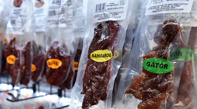 Beef Jerky Outlet recently opened a new location at Cincinnati Premium Outlets in Monroe, a little more than a year after opening its first Ohio location in West Chester Twp. The store features more than 100 varieties of premium jerky, many of which can be sampled before being purchased. NICK GRAHAM/STAFF