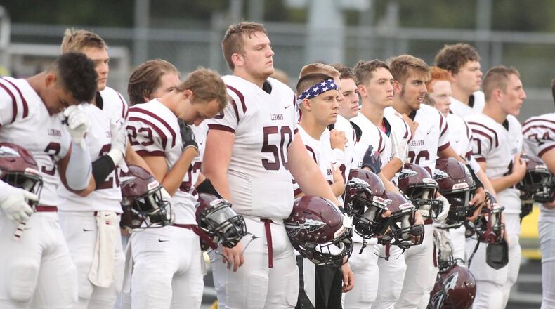Lebanon lines up for the national anthem before a game against Springfield on Friday, Sept. 21, 2018, at Evans Stadium in Springfield. David Jablonski/Staff